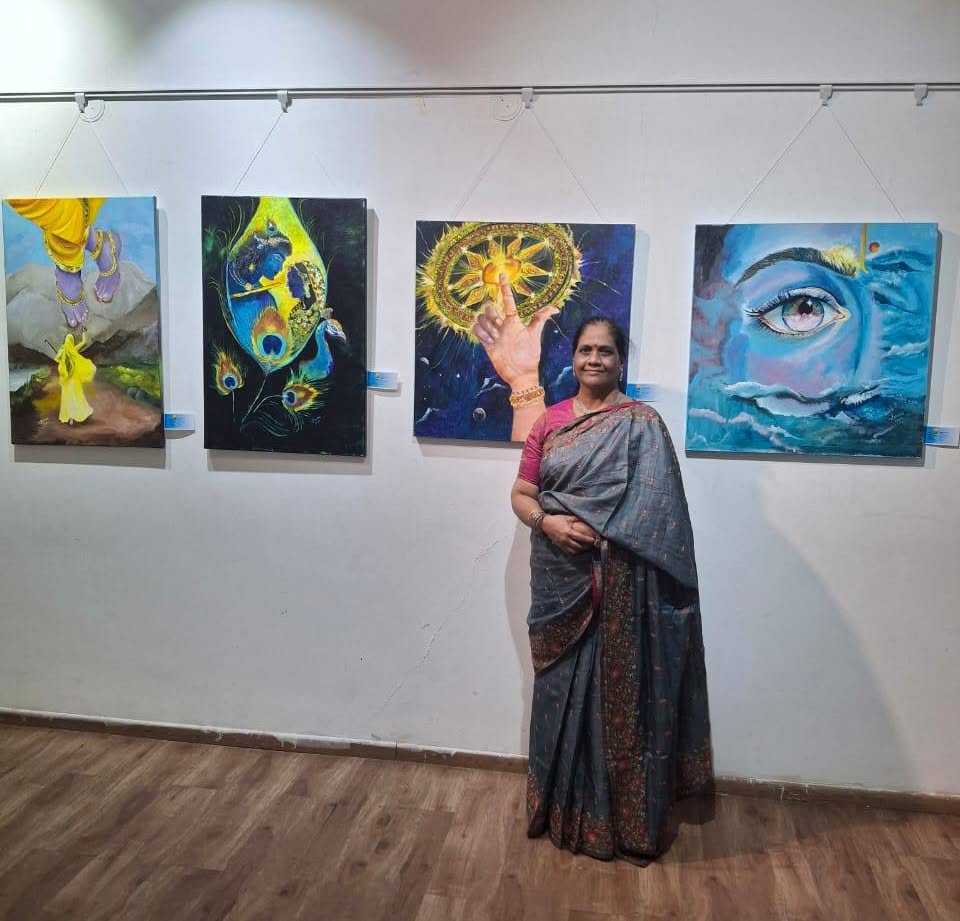 Rujuta Danait with her paintings at an exhibition