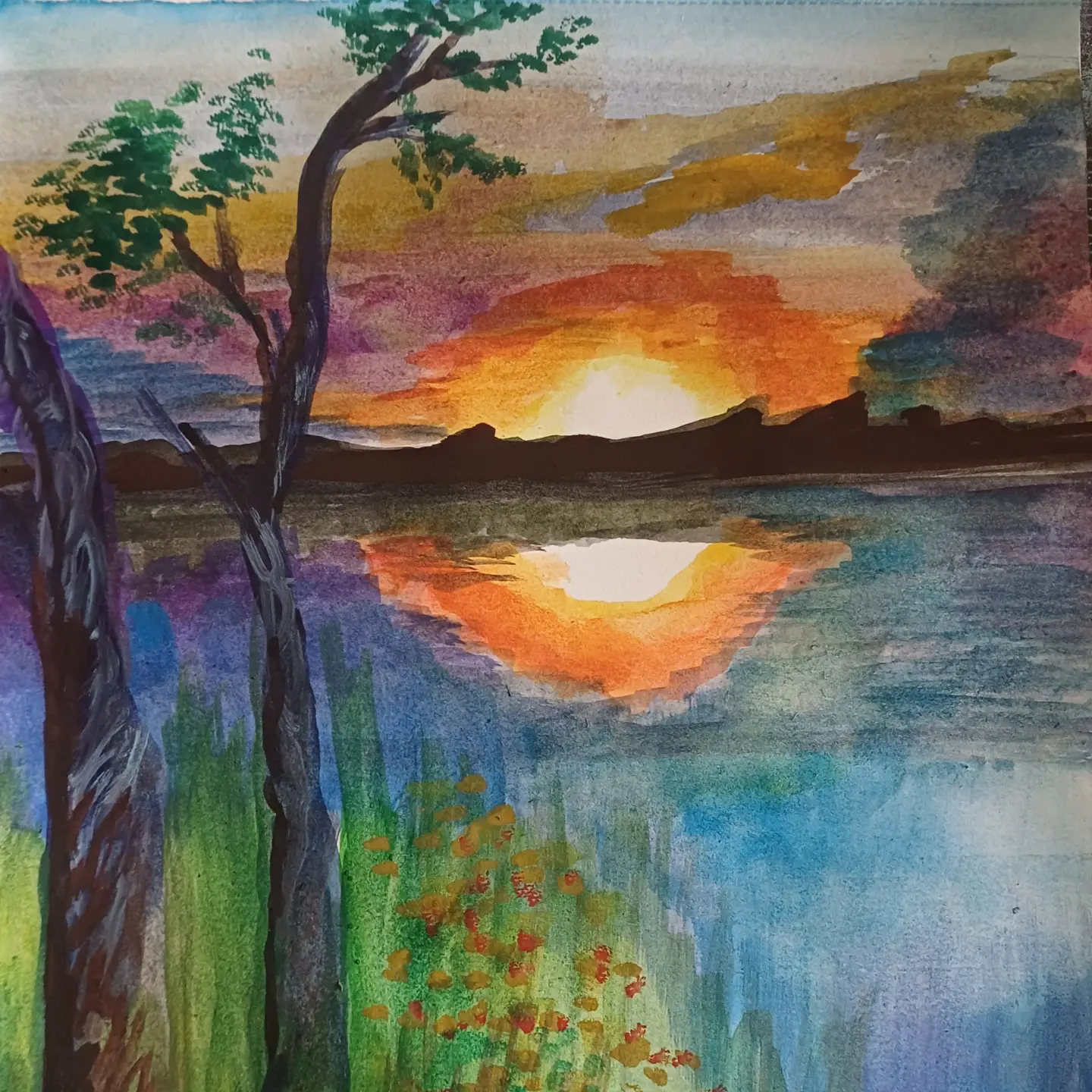 Sunset and its reflection in water